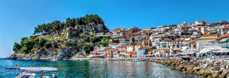 Colourful houses along the harbour below the castle hill